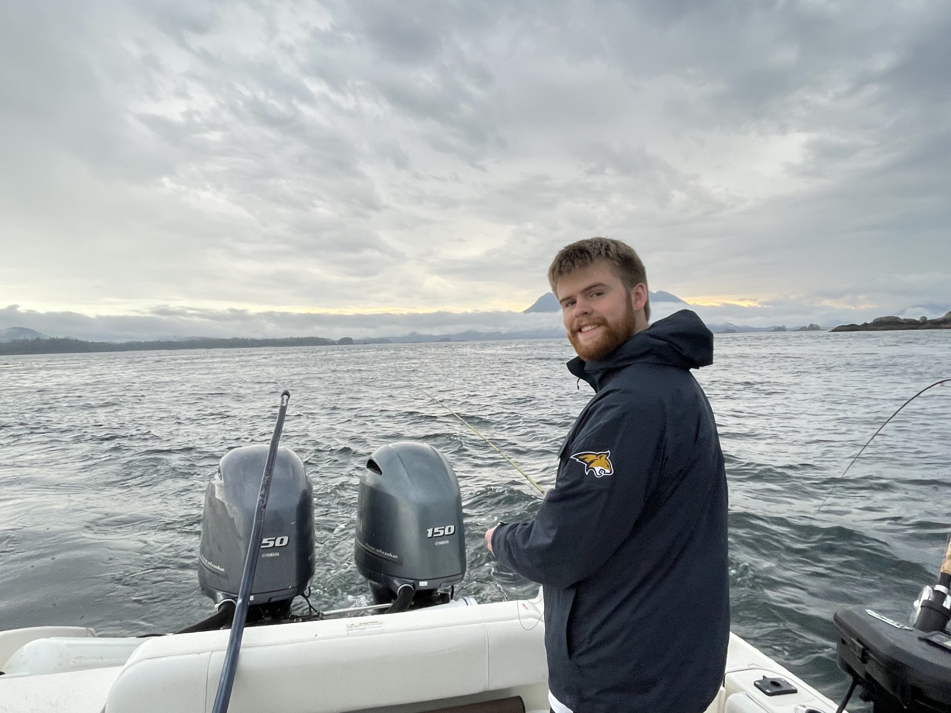 Portrait of Heath Sullivan on a boat off the coast